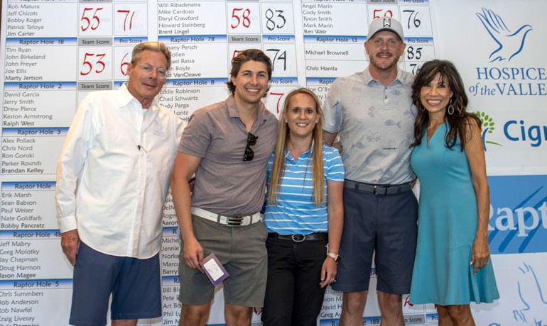 Michael Ressa, Bethany Persch, Joe Solien, Jay Hoselton, and Lin Sue Cooney standing in front of leader board