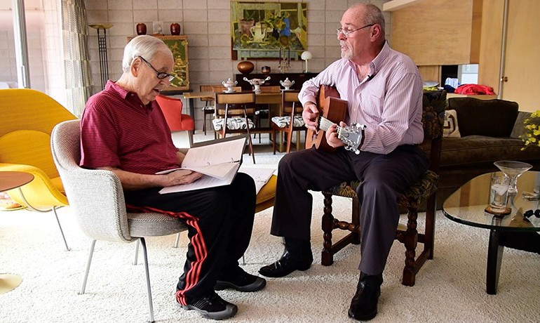 Music therapy patient and instructor playing music