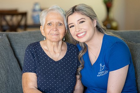 Clara Mroz-Brown sitting with patient