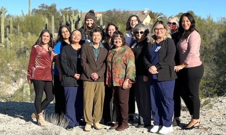 Tucson team posing together outdoors