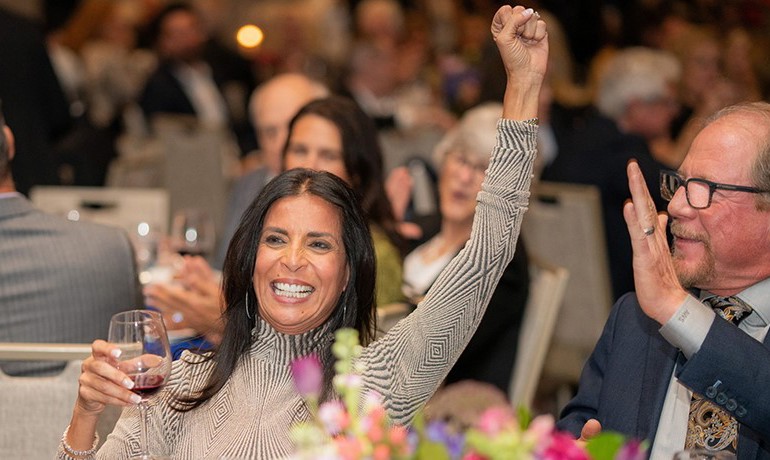 Mona and Kelly Sands celebrate an auction win