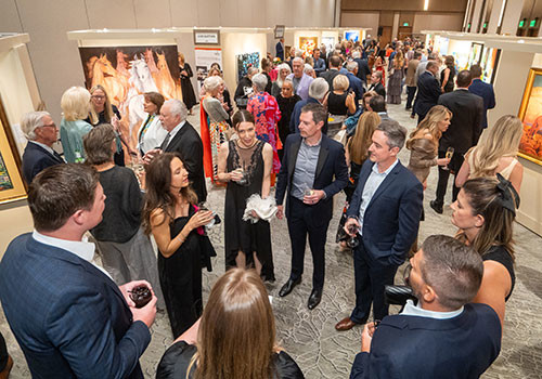 People walking about art gallery at aaha annual event