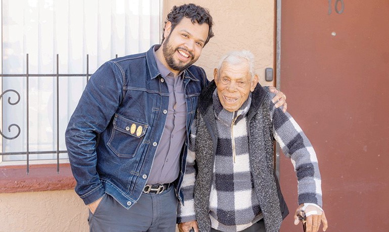 Brian Robles smiling with Jacobo Dieppa