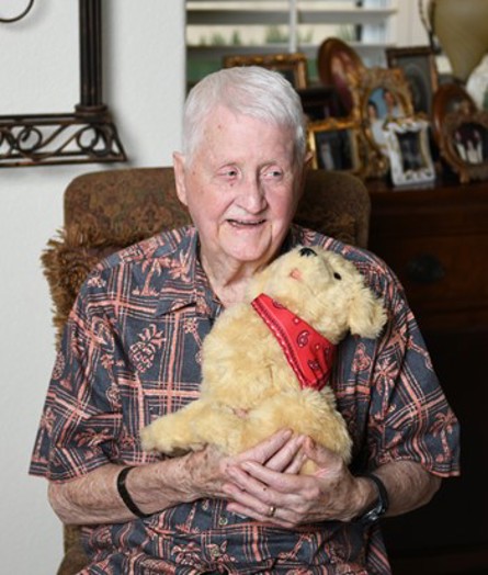 Buddy Stapp's wife says his communications skills have improved since he got his mechanical pup.