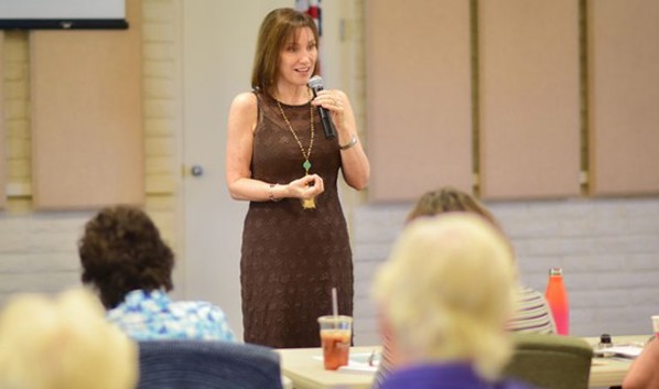 Dr. Maribeth Gallagher speaking to audience