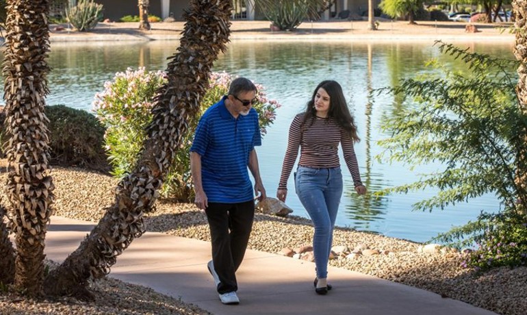 John O'Donnell and Arabella Yousif walking together outside